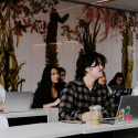 students with laptops sitting at desks