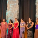 scholars on stage in formal wear to accept awards