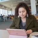 A PINC student looks at her laptop