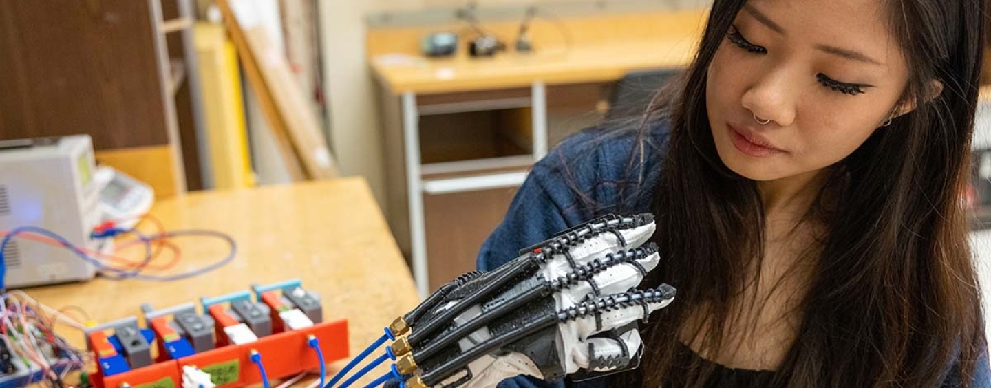 Lauren Gan with exoskeleton glove