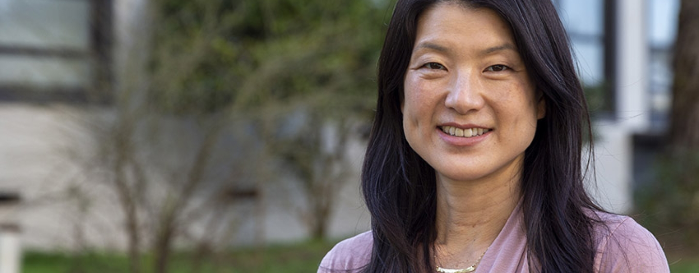 SF State Professor of Biology Andrea Swei headshot with grass and building in the background