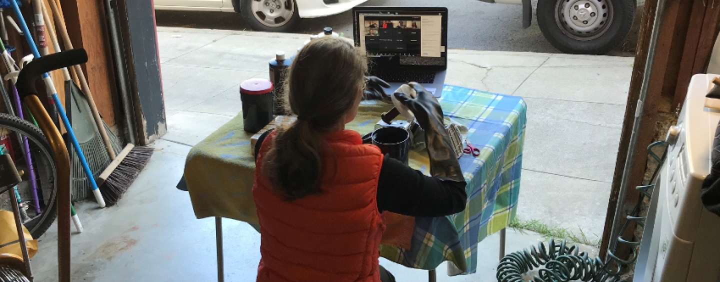 Professor Snider demonstrates a film processing technique in her garage 