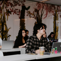 students with laptops sitting at desks