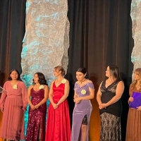scholars on stage in formal wear to accept awards